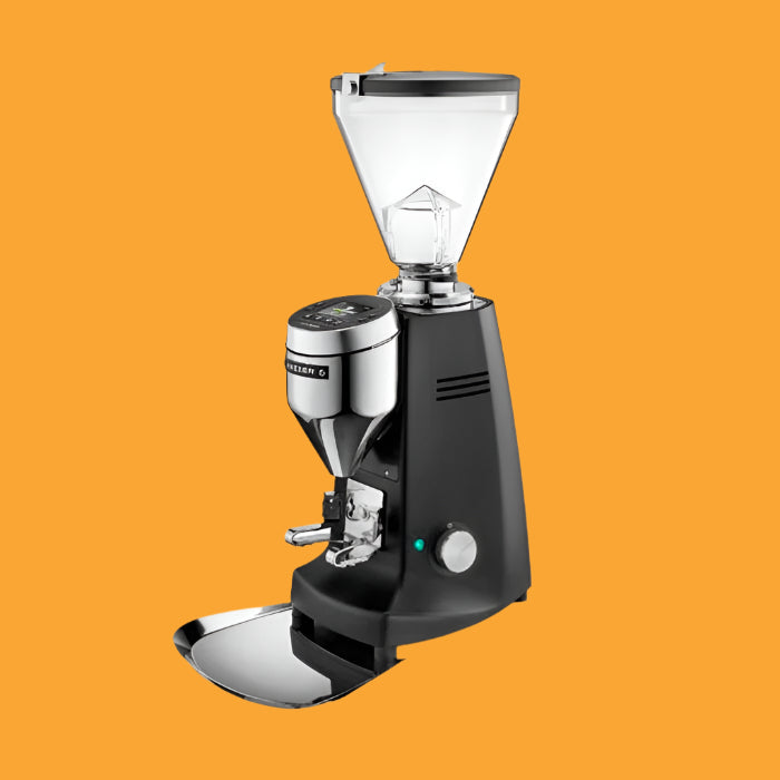 Electronic coffee grinder with a black body, clear grind container, and a silver crank.